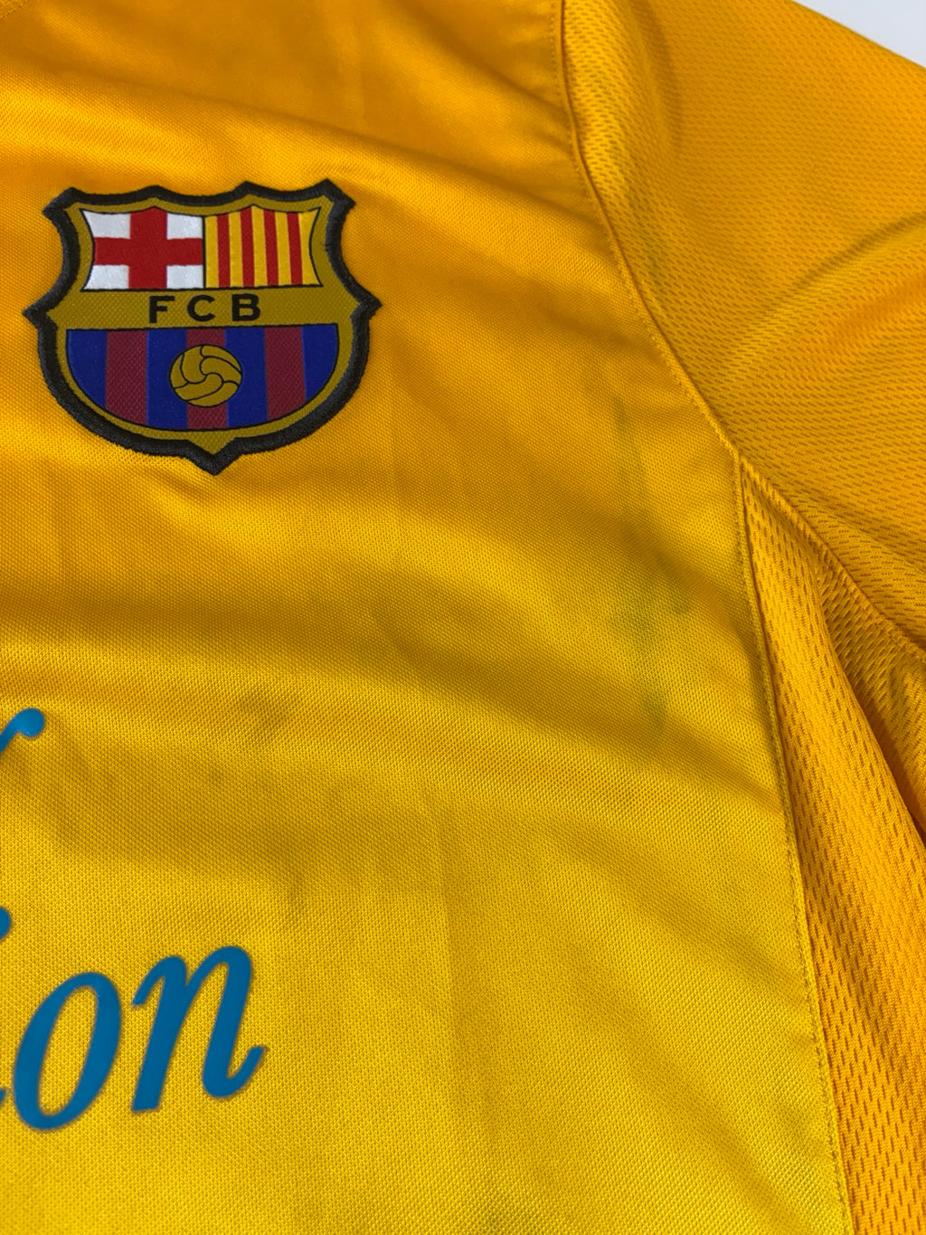 FC Barcelona crest and fabric detail on 2011/12 Nike training shirt