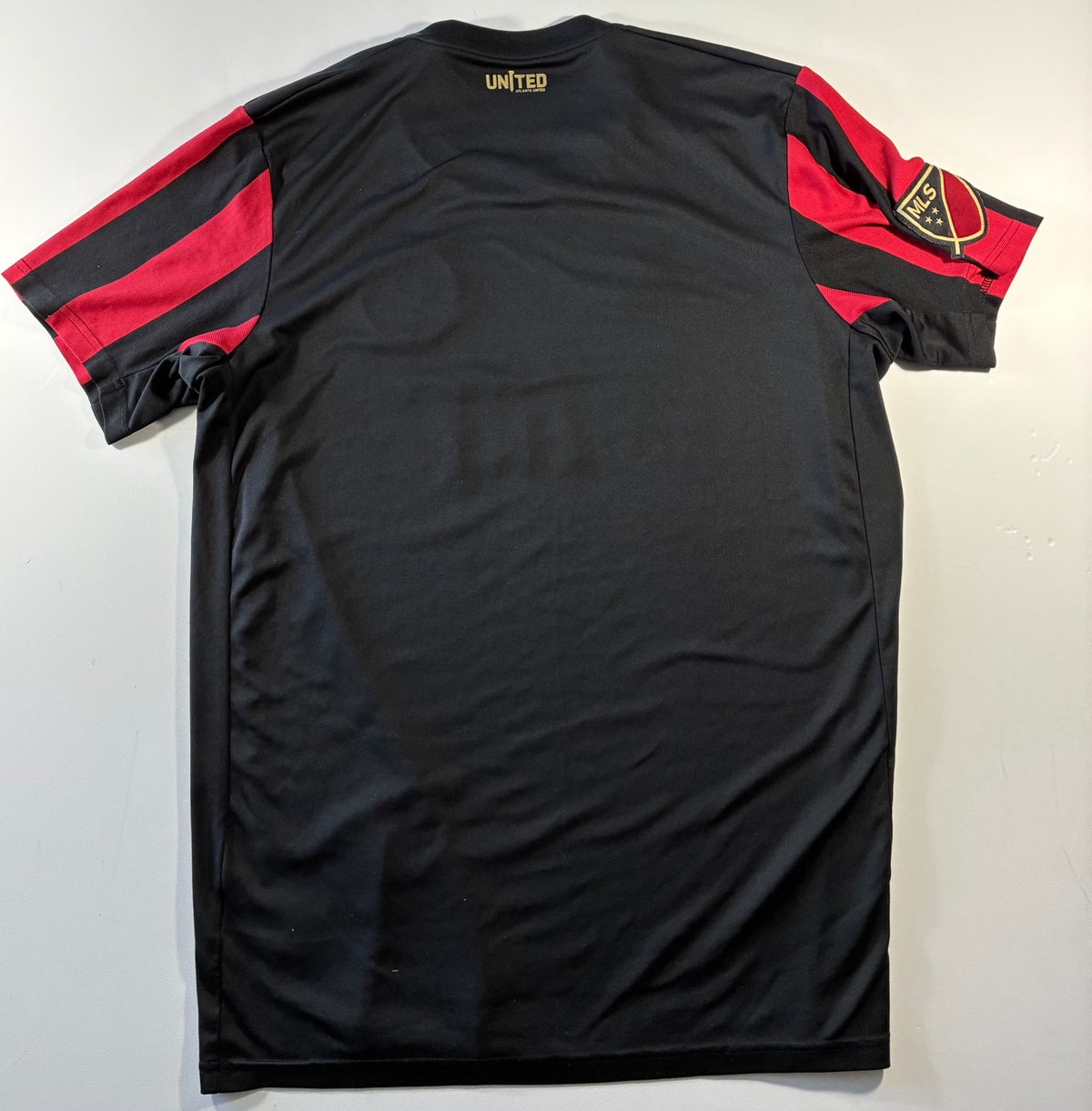 Atlanta United red and black home shirt — back