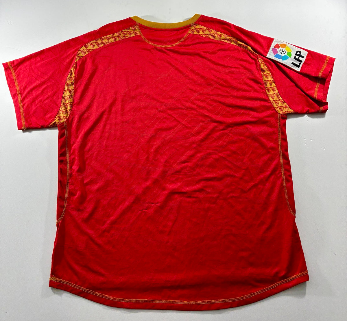 Sevilla red and gold Joma shirt — back