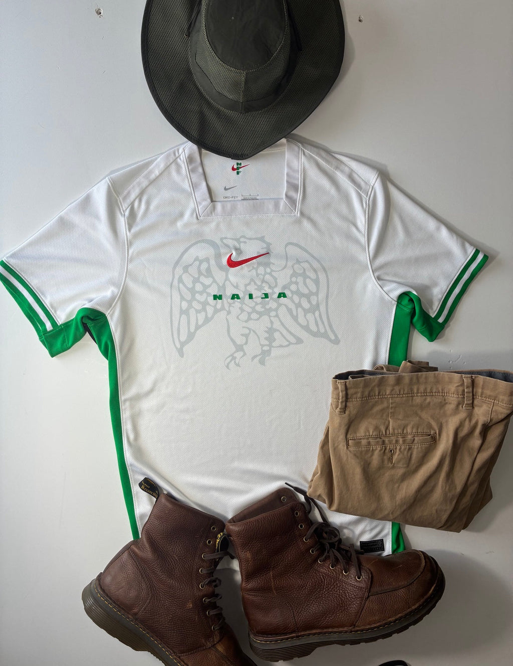 Nigeria 2024-25 Nike home shirt size Large styled casual flat lay